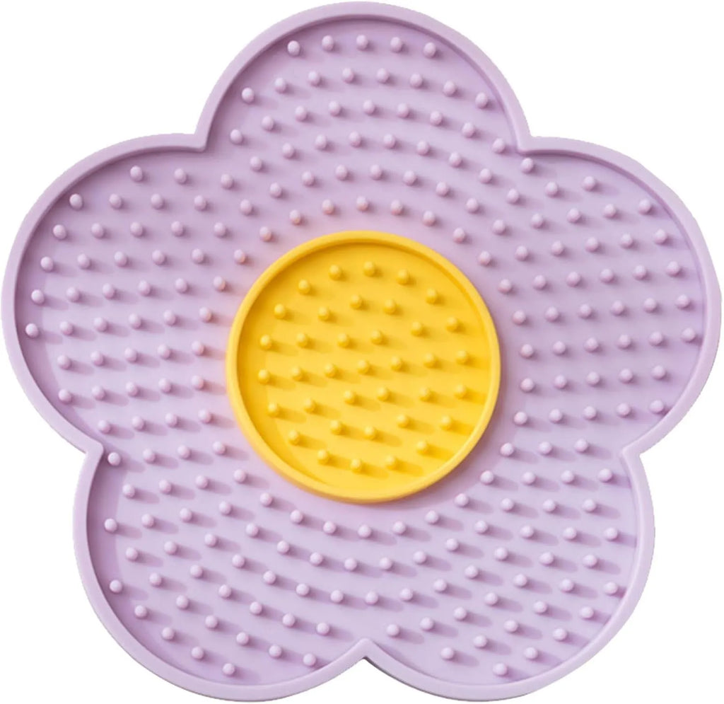 Flower-shaped silicone pet licking mat with suction cups on back in blue, grey, pink, purple, or red