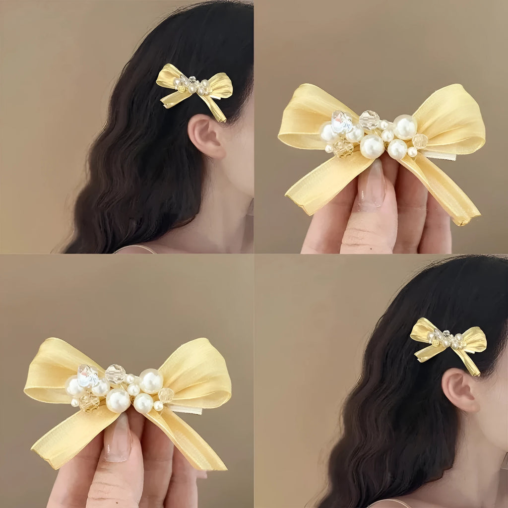 Yellow bow barrette with rhinestone and pearl on duckbill clip for women