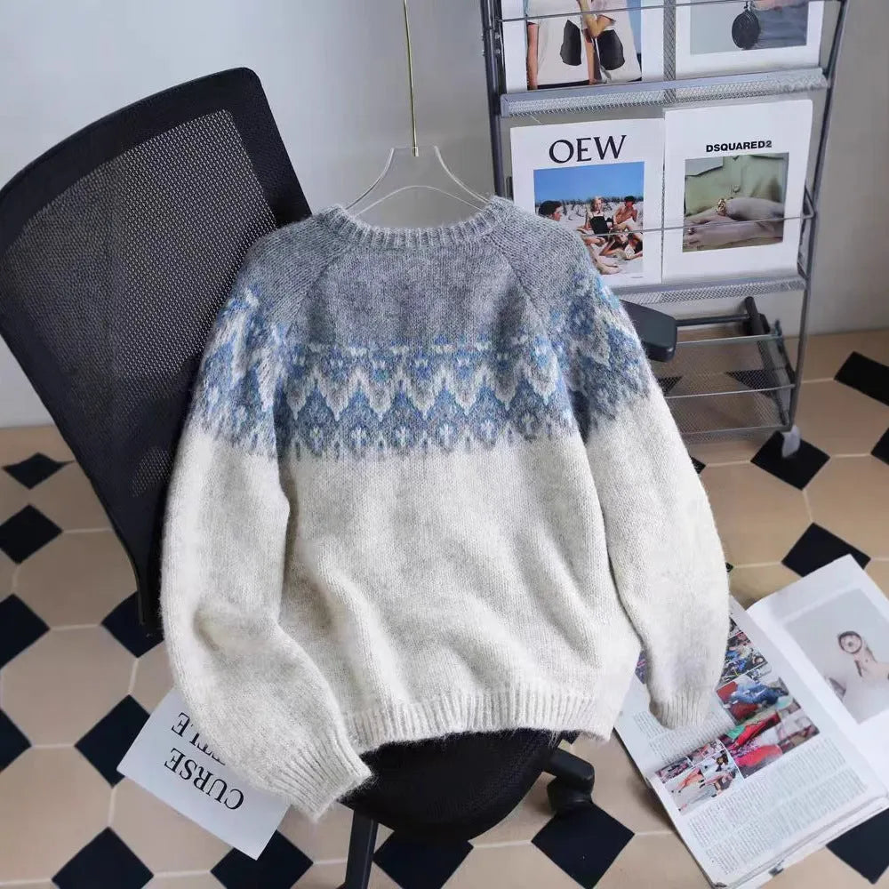 Women's brown jacquard patterned sweater coat with a loose fit and long sleeves.