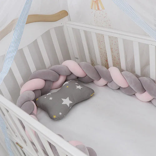 Baby crib bumper braid knot pillow cushion in spandex velvet, shown in a light grey colour