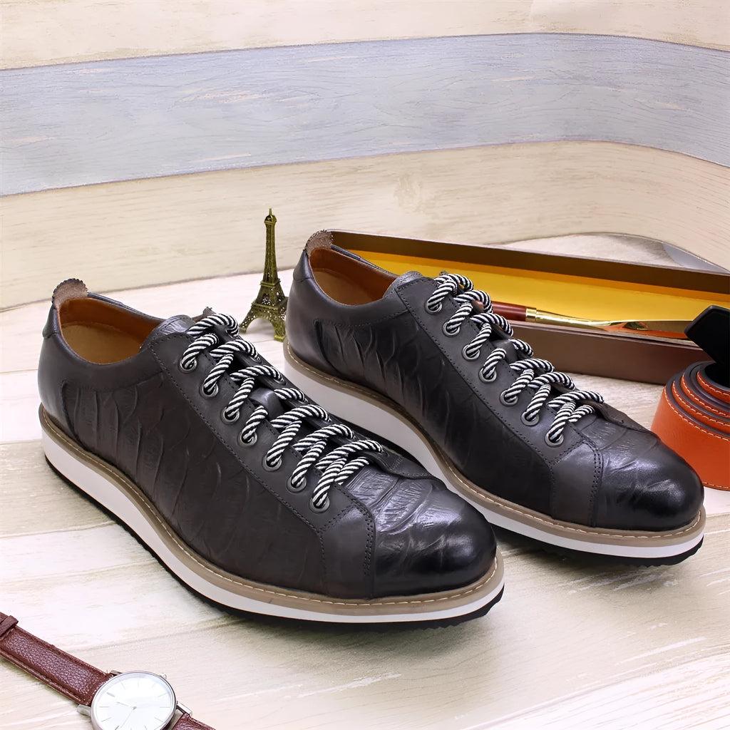 Men's low-top leather sneakers with an embossed pattern on the upper, shown in a choice of colours.