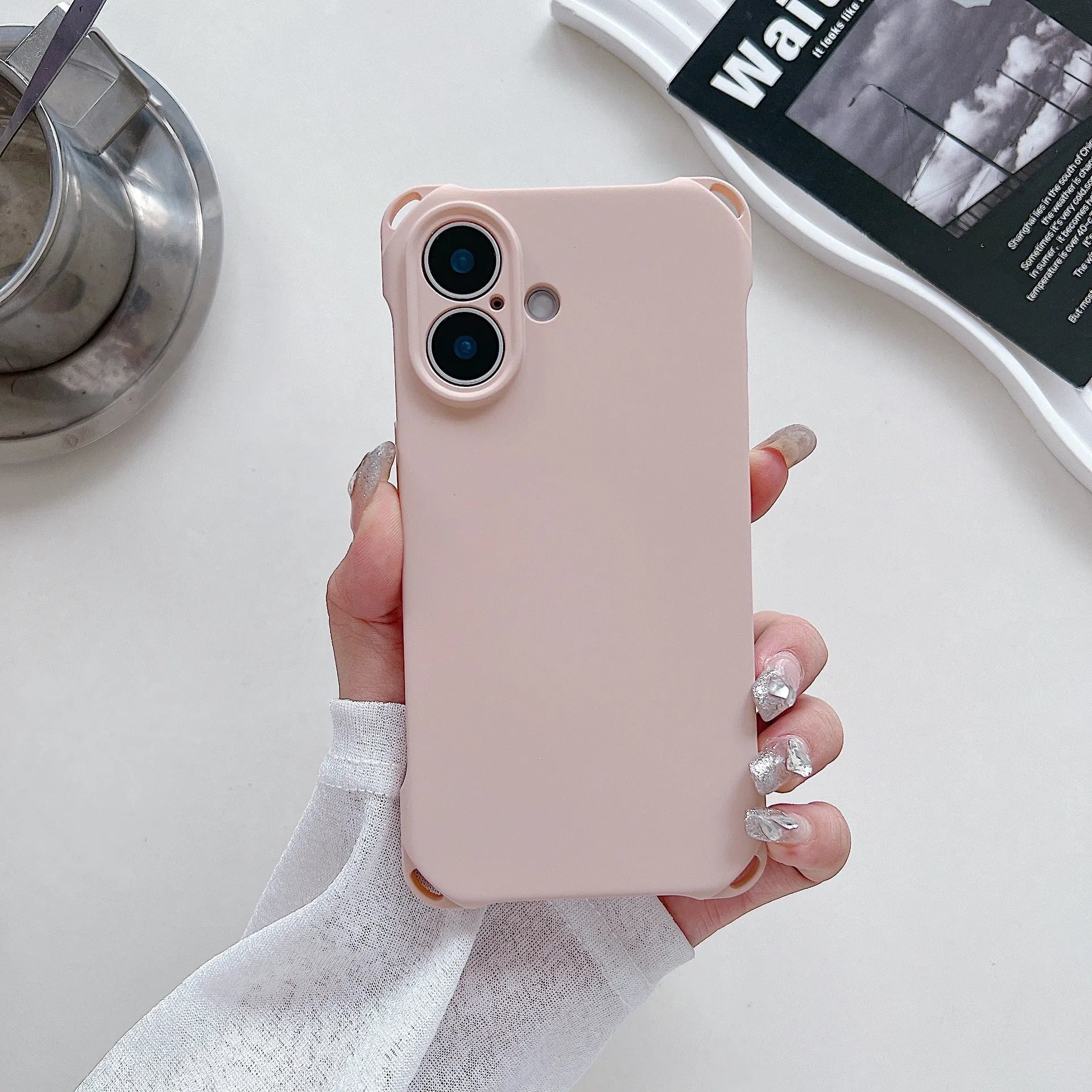 Four-corner cross lanyard liquid silicone phone case for Apple iPhone 16 in antique white with matching lanyard