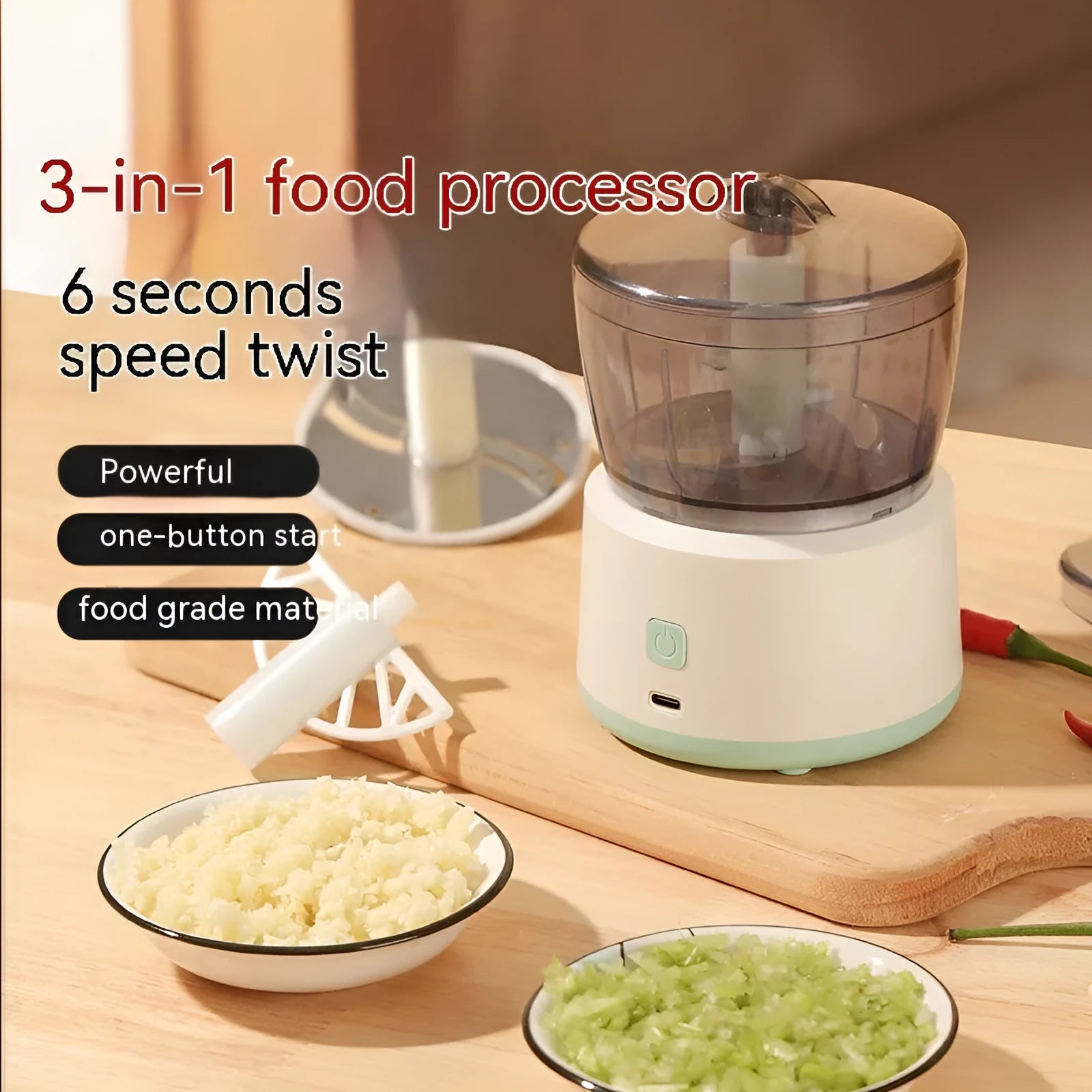 Mini electric meat grinder in light green with transparent cup and stainless steel blades