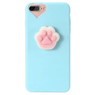 A soft pink silicone iPhone case featuring a raised 3D cartoon cat design on the back.