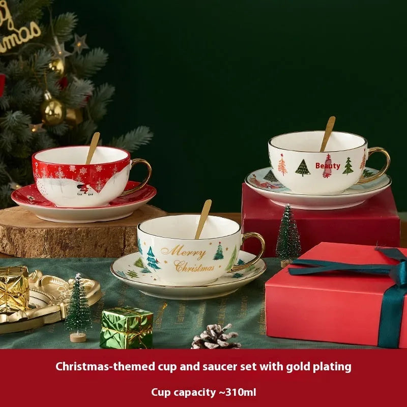 Ceramic gold-plated Christmas teapot set with snowflake design, including pot on dish and cup on dish with spoon, in gift box.