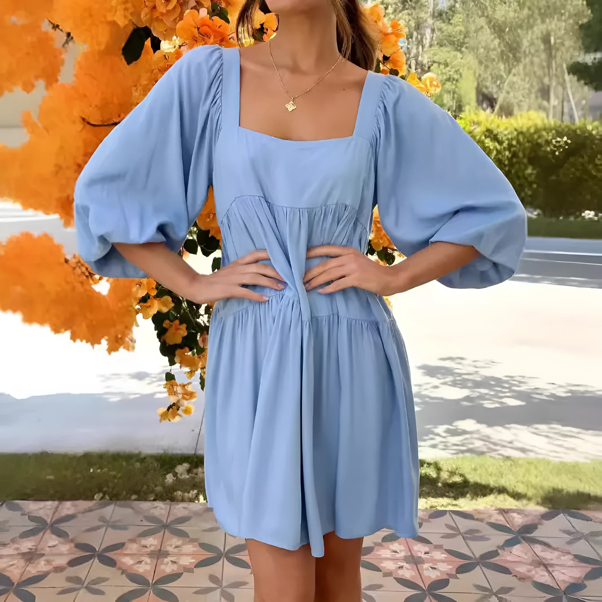 Children's orange backless pullover dress with square collar and puff sleeves showing A-line skirt silhouette