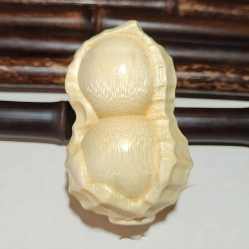 Natural solid bamboo peanut ornament with carving detail and modern simple style