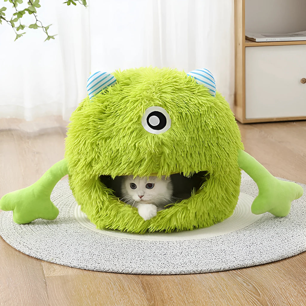 Fluffy round plush cat bed with a non-slip base, shown in a home setting.