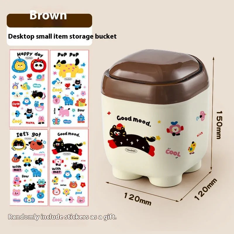 Red and brown cartoon sticker designs on a plastic desktop storage box with grid organiser compartments.