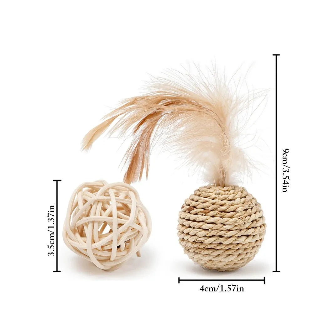Two cat toys: a hollow rattan ball and a faux feather ball with a bell on a white background.