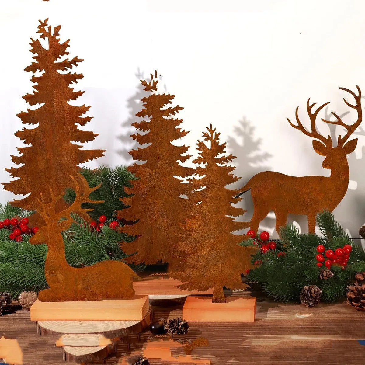 Three metal Christmas tree ornaments with elk figurines and rustic metallic finish