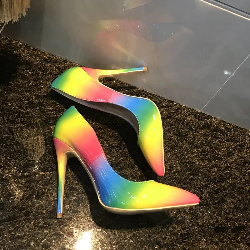 Rainbow coloured patent leather pointed toe high heels with thin ultra-high heel.
