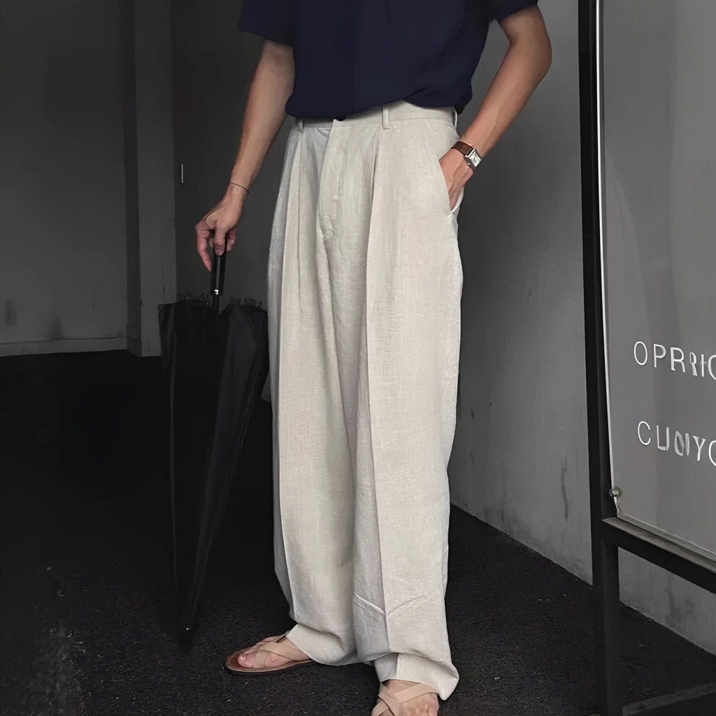 Men's light-weight apricot coloured cotton linen trousers with a loose Korean fit and pencil leg opening.