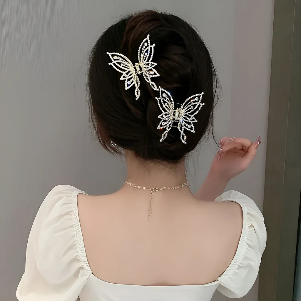 Butterfly hair barrettes in alloy with rhinestone or pearl styles measuring 6.7x6.2cm
