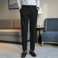 Straight-leg brown corduroy trousers with an elasticated waistband laid flat.