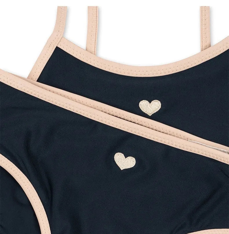 Dark blue baby girl swimsuit in polyester with Lycra lining for swimming activities