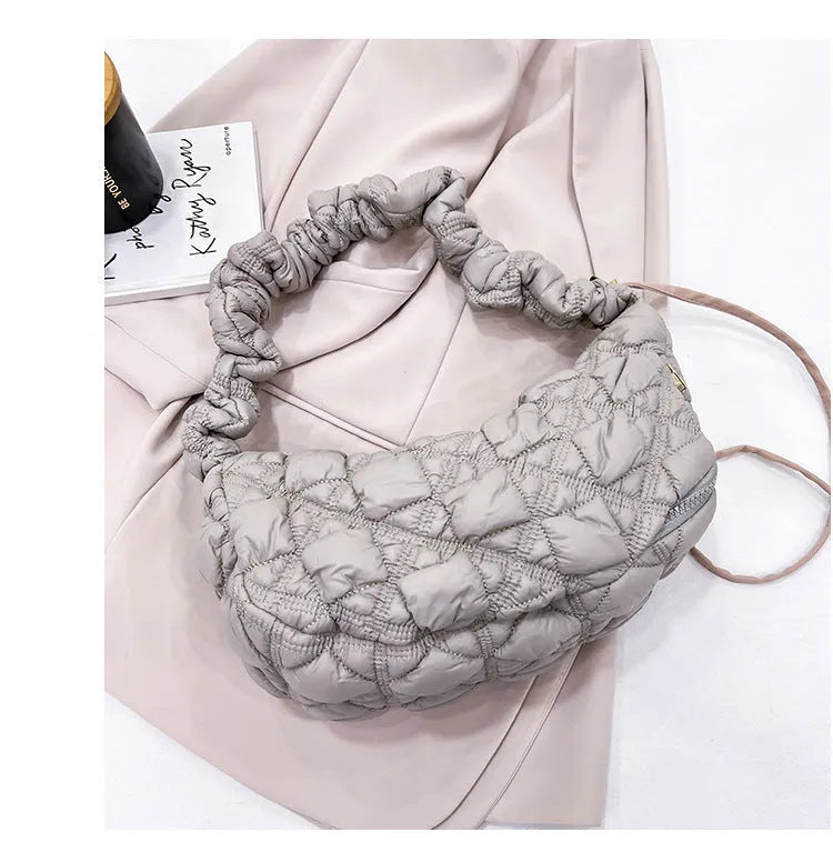 Women's nylon messenger bag in a solid colour with adjustable shoulder strap showing 35cm width.