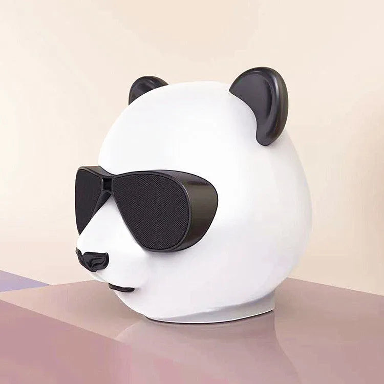 A portable classic style mini Bluetooth speaker on a table, showing its compact design.