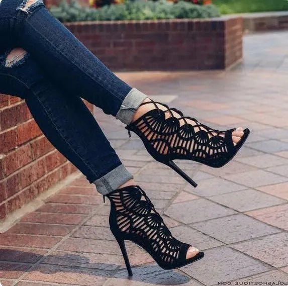 Black lace high heels with suede upper, fish mouth toe, stiletto heel above 8cm, and hollow design.