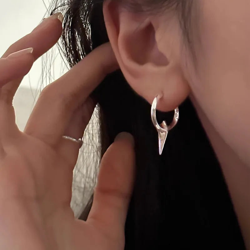 Women's geometric star-shaped ear clip earrings with a copper white gold electroplated finish.