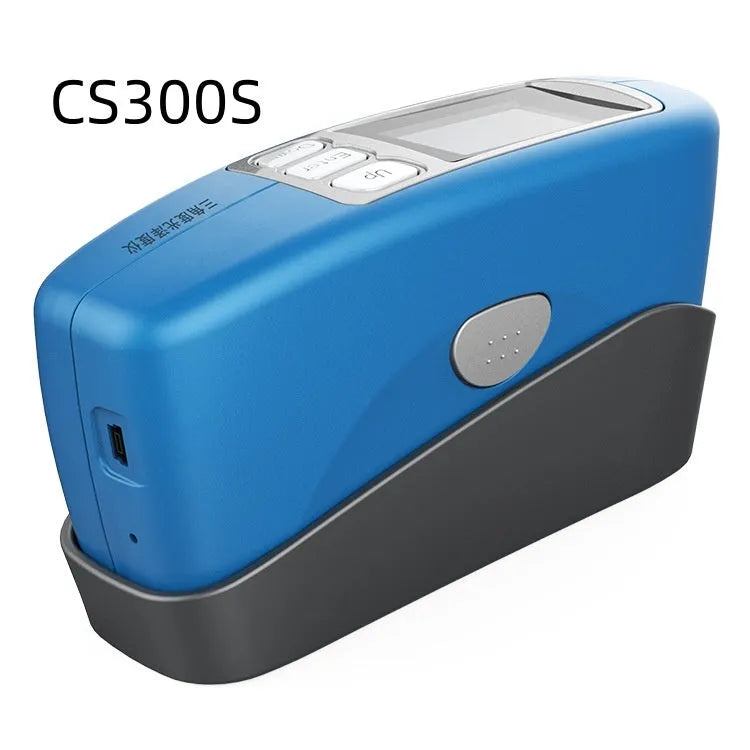 Handheld ceramic brightness stone portable glossiness tester gloss meter on a work surface.
