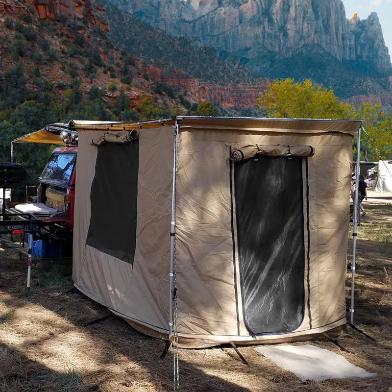 Black rainproof camping tent with aluminium poles set up outdoors, showing two-bedroom interior and Oxford cloth base.