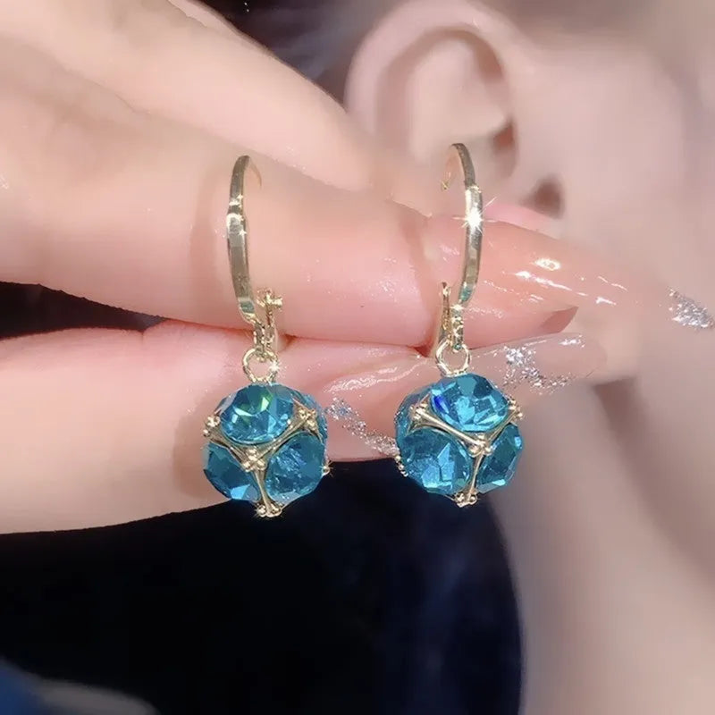 Women's copper geometric drop earrings with rose design and zircon accents in electroplated finish