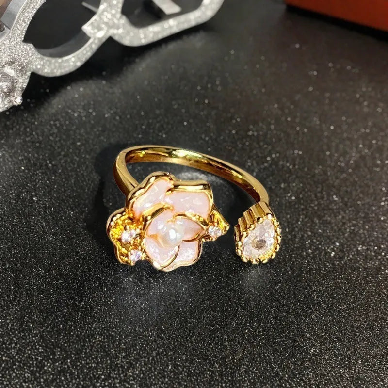 Adjustable copper women's ring with vintage oil drip finish, gourd shape, and inlaid zircon stones in floral and bow designs.