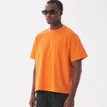 Loose fit pure cotton short sleeve T-shirt on a hanger, shown in apricot colour.
