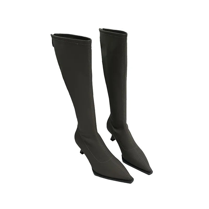 Black women's pointed toe below-knee boots with stiletto heel and back zipper on a white background.