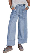 Beau blue wide leg denim pants on a hanger, showing drawstring waist and raw hem detail.