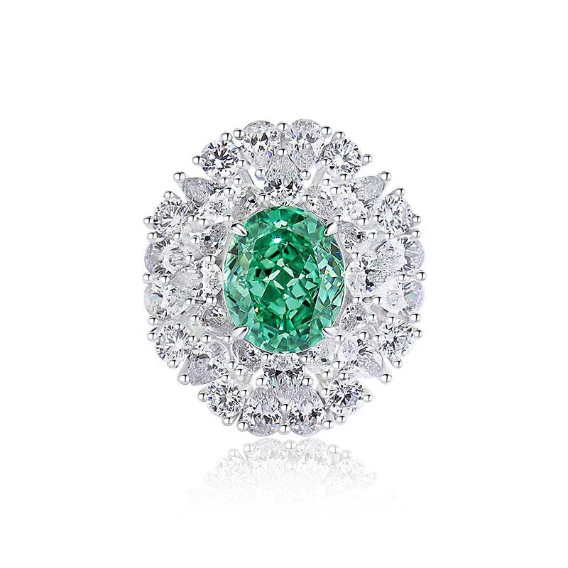 S925 sterling silver women's ring with a green emerald in a Palaibahao design and an inlaid high-carbon diamond on a geometric ellipse band.