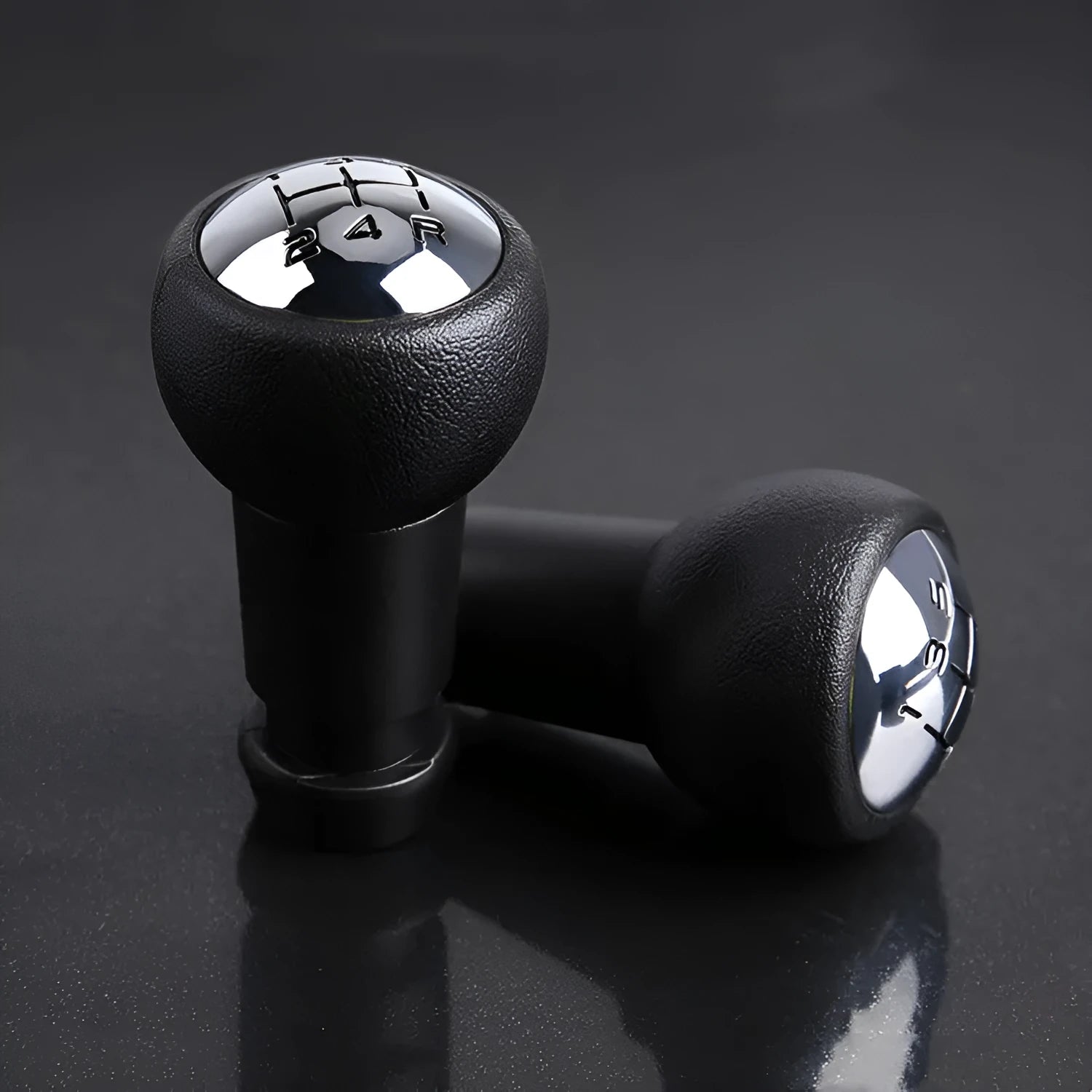 Black GM universal manual transmission gear head on a shift lever