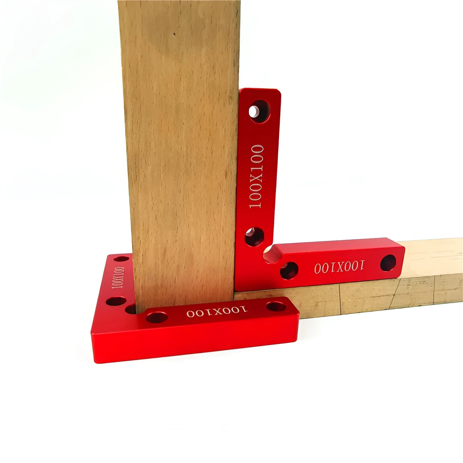 Aluminium woodworking right angle positioning block with scale, shown next to a jigsaw.