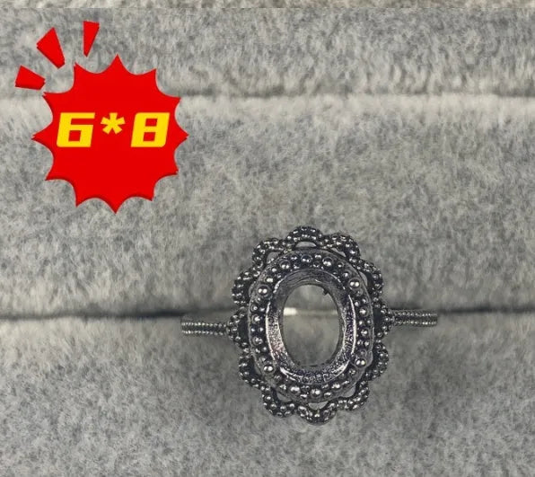 Oval denier ring ornament with 6x8mm stone, open mouth design, and five-pointed star detail
