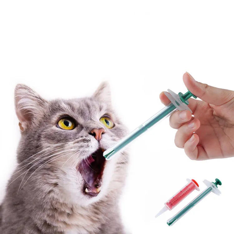 Two silicone pet pill shooters, one larger and one smaller, with soft tips and push rods.