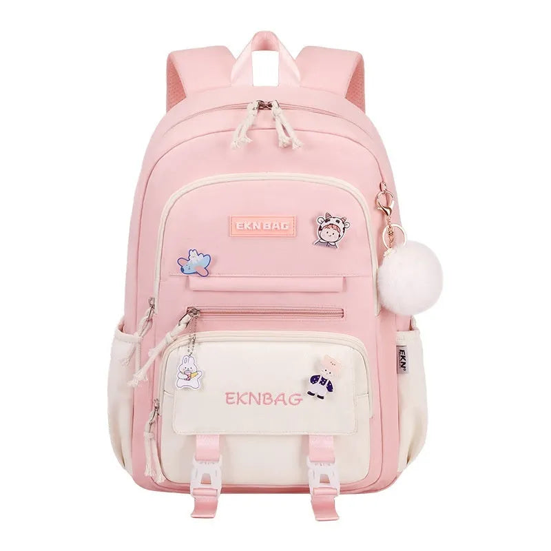 Pink waterproof school backpack for girls with curved straps, shown with matching pencil case and bag.