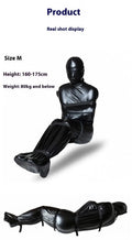 Black patent leather bondage set showing full coverage body wrap with six ratchet tie down restraints