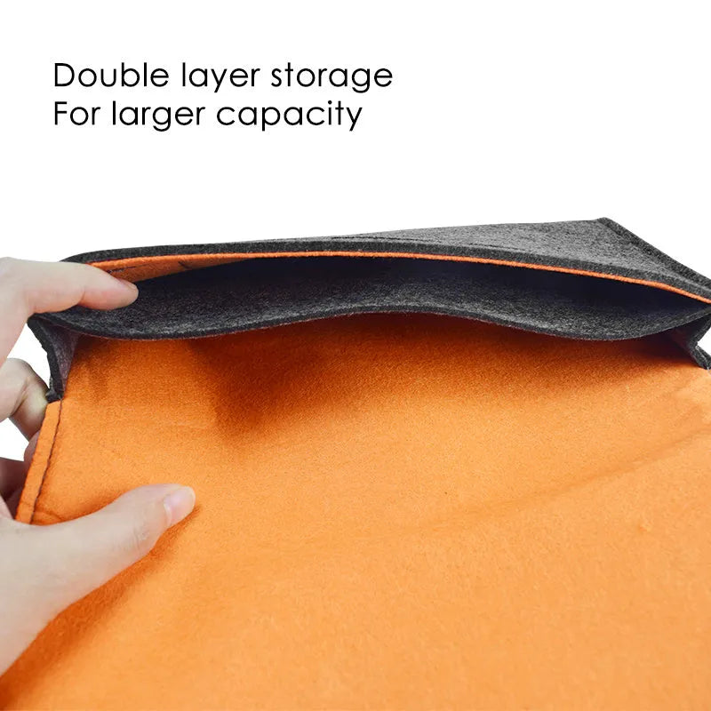 Black felt storage pouch for Nintendo Switch console with game card slots open