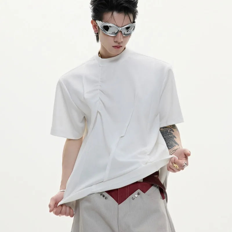 Men's loose grey cotton T-shirt with pleated detail and round neck.