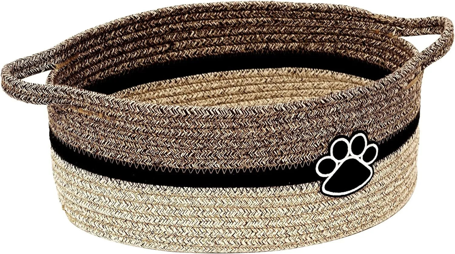 Light beige handmade woven cotton rope storage basket with handle on a wooden floor.