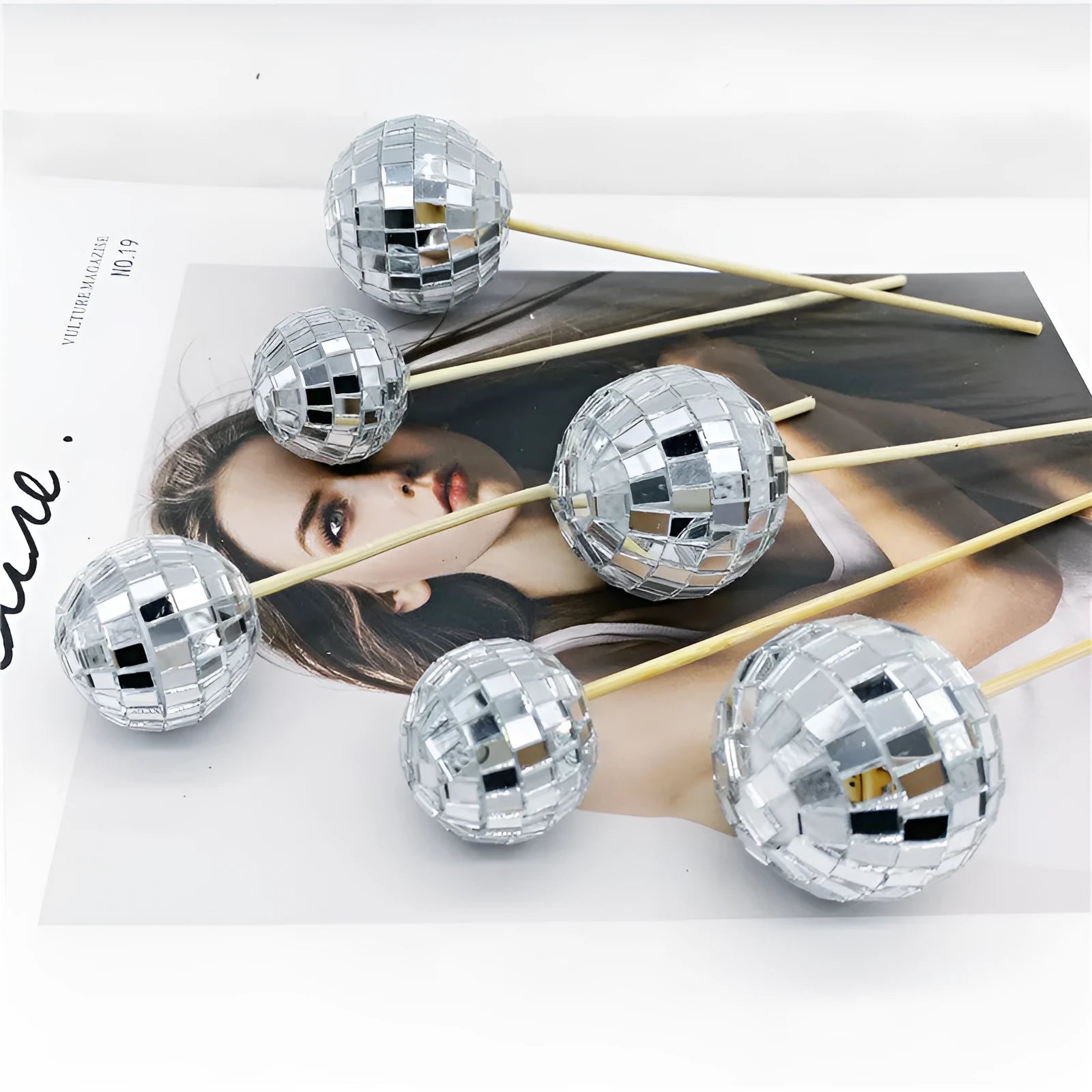 Glass disco ball cake decoration on wooden stick available in four sizes from 2.5cm to 5cm diameter