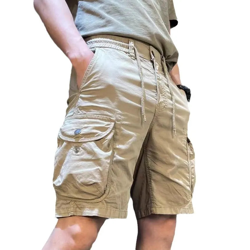 Loose straight casual overalls pants in black colour with multiple pockets and elastic waistband.