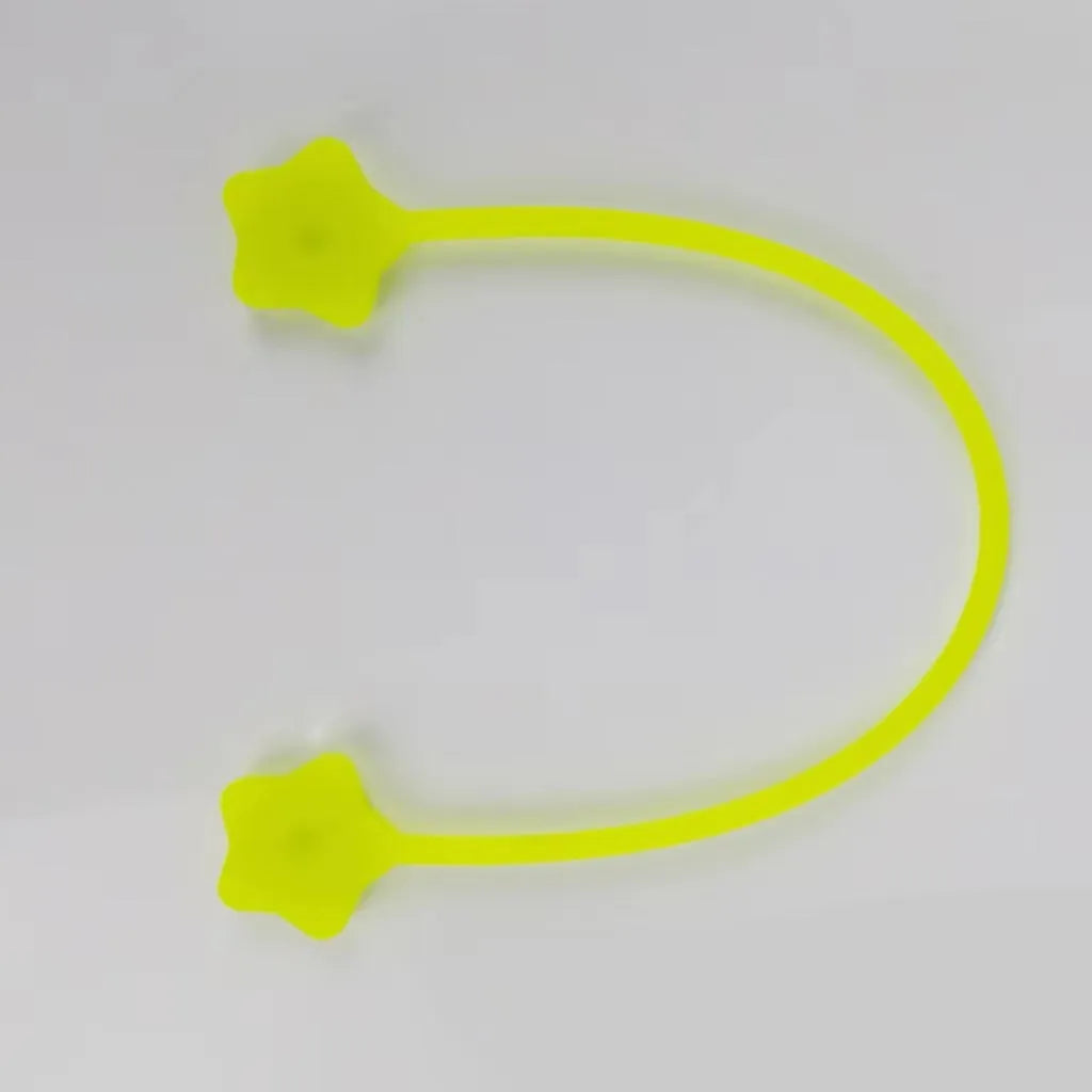 Star-shaped silicone cable winder with magnet for organising mobile phone and headphone wires.