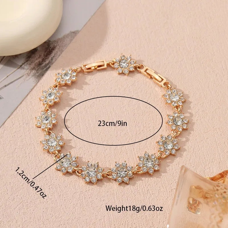 Flower design fashion bracelet in zinc alloy showing electroplated colour options with crystal and simulated diamond elements