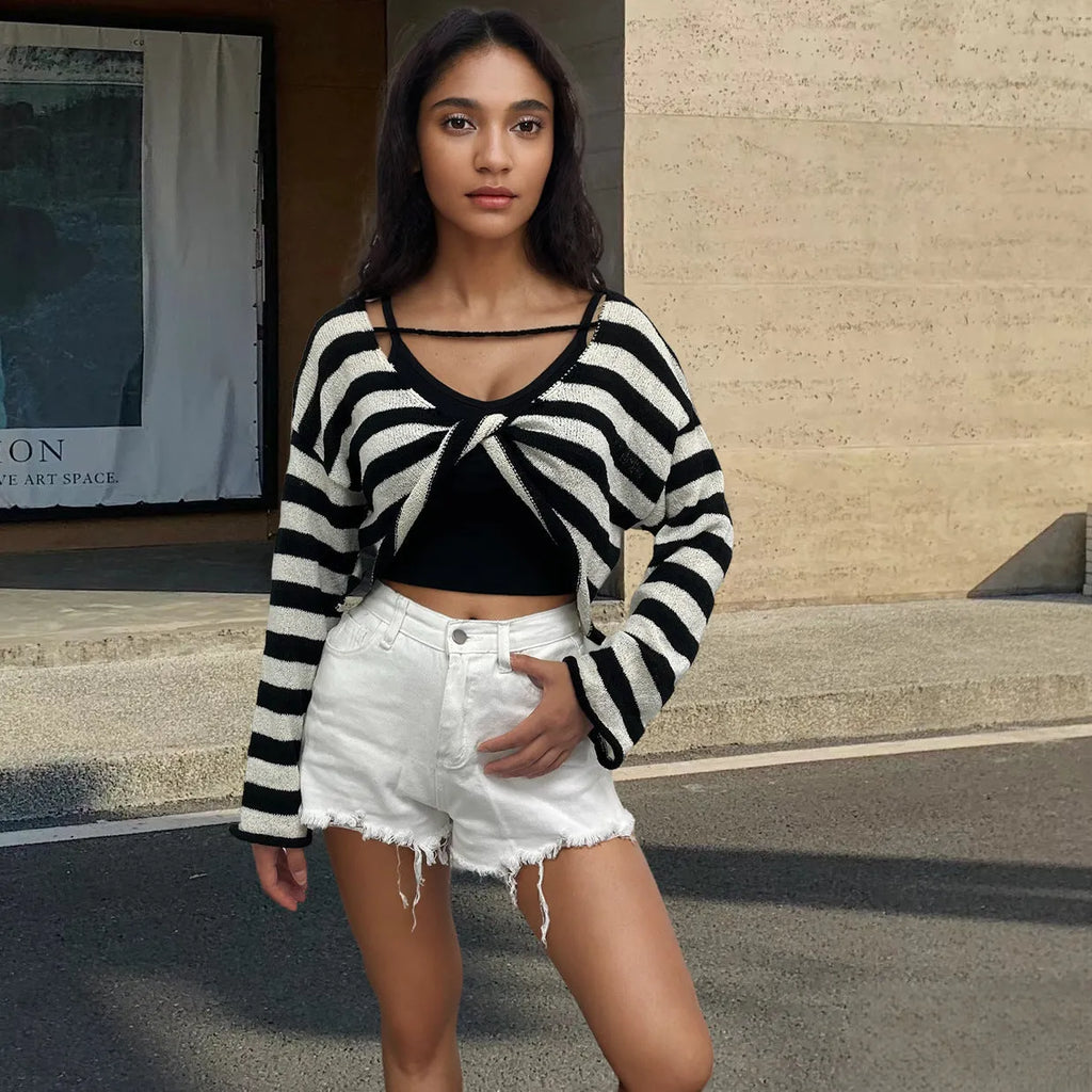 Striped long-sleeved pullover sweater in mercerized cotton shown in multiple colours with front and back wearable design.