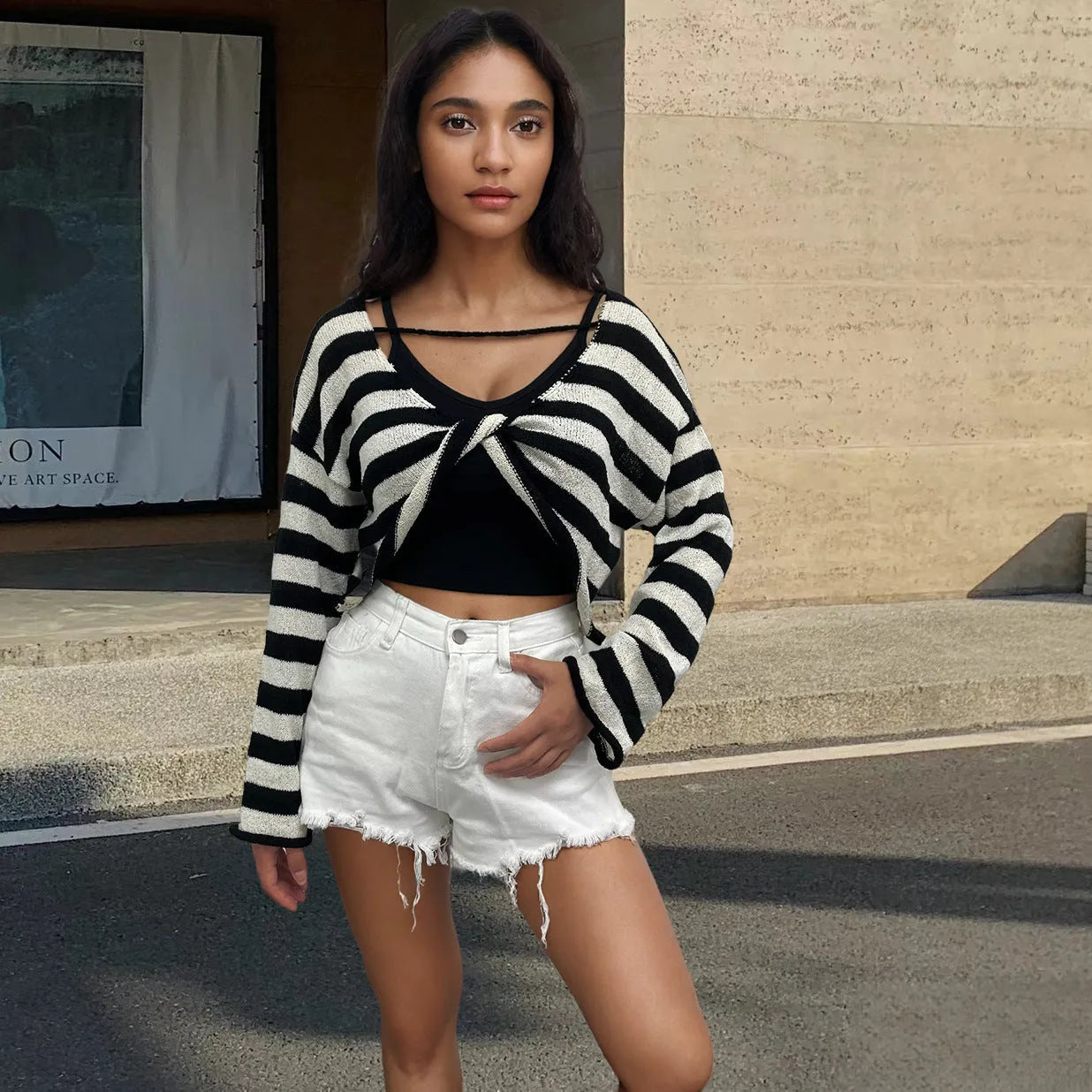Striped long-sleeved pullover sweater in mercerized cotton shown in multiple colours with front and back wearable design.