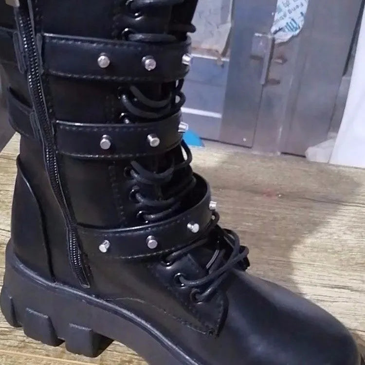 Black women's mid-calf buckle boots with side zip and round toe on a white background.