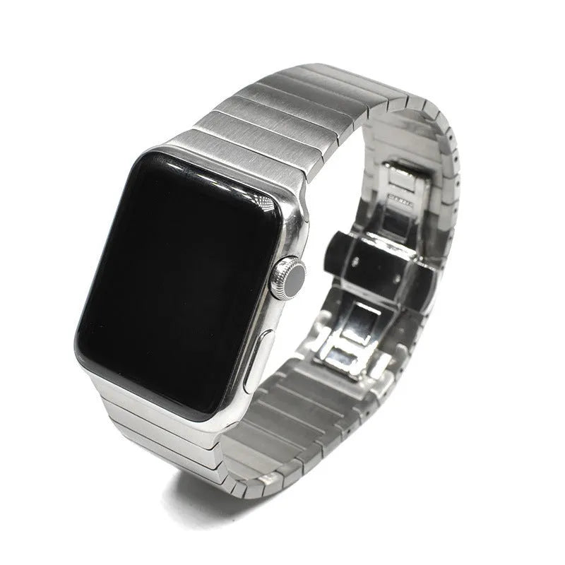 Stainless steel metal chain link strap with butterfly clasp for Apple Watch in silver colour.