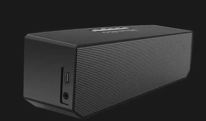 Black cloud smart speaker with 52mm driver showing micro-USB charging port